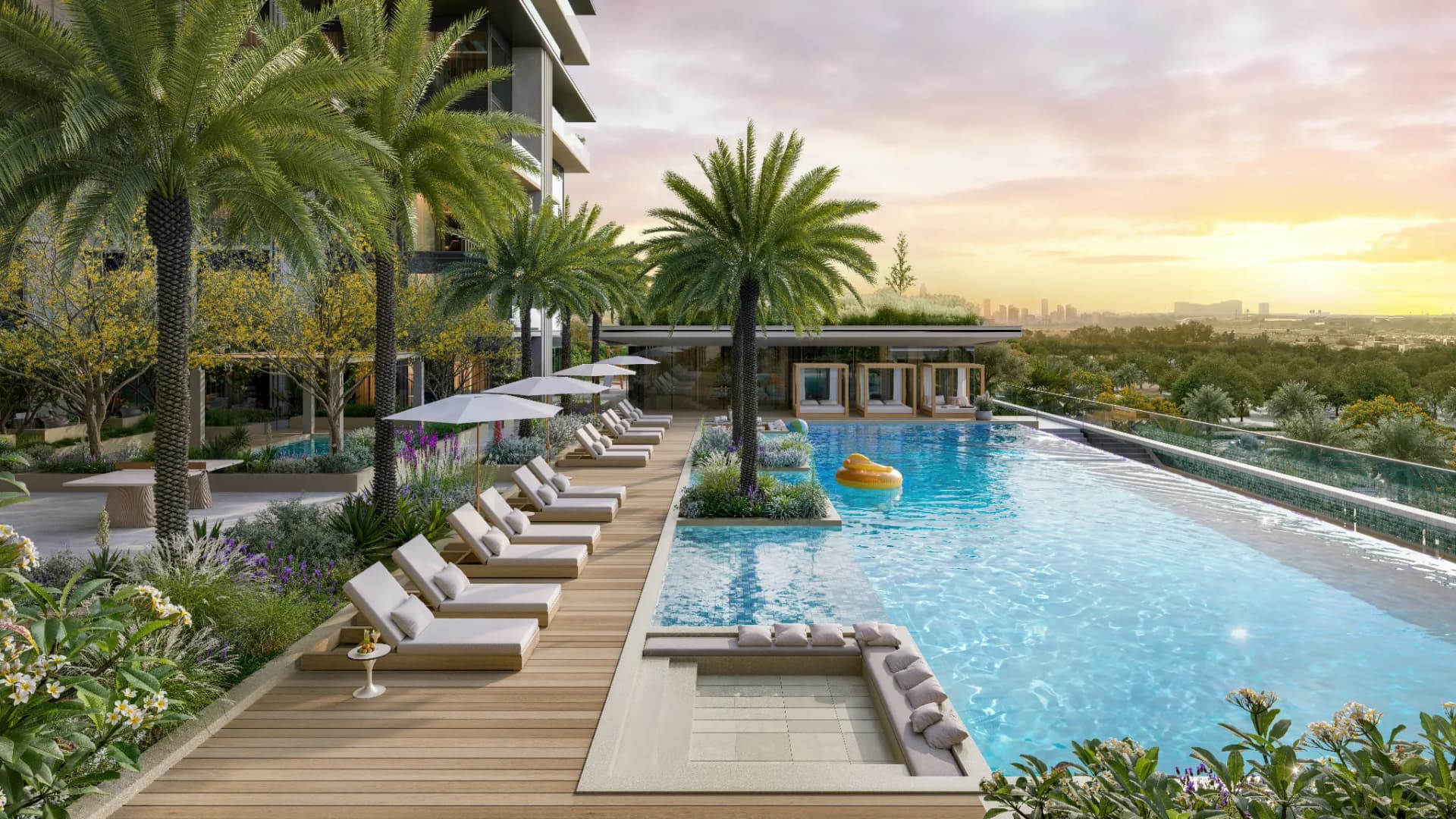 Aerial resort-style pool deck at Everly Place by Ellington in Meydan Horizon, MBR City Dubai, with loungers and palms.