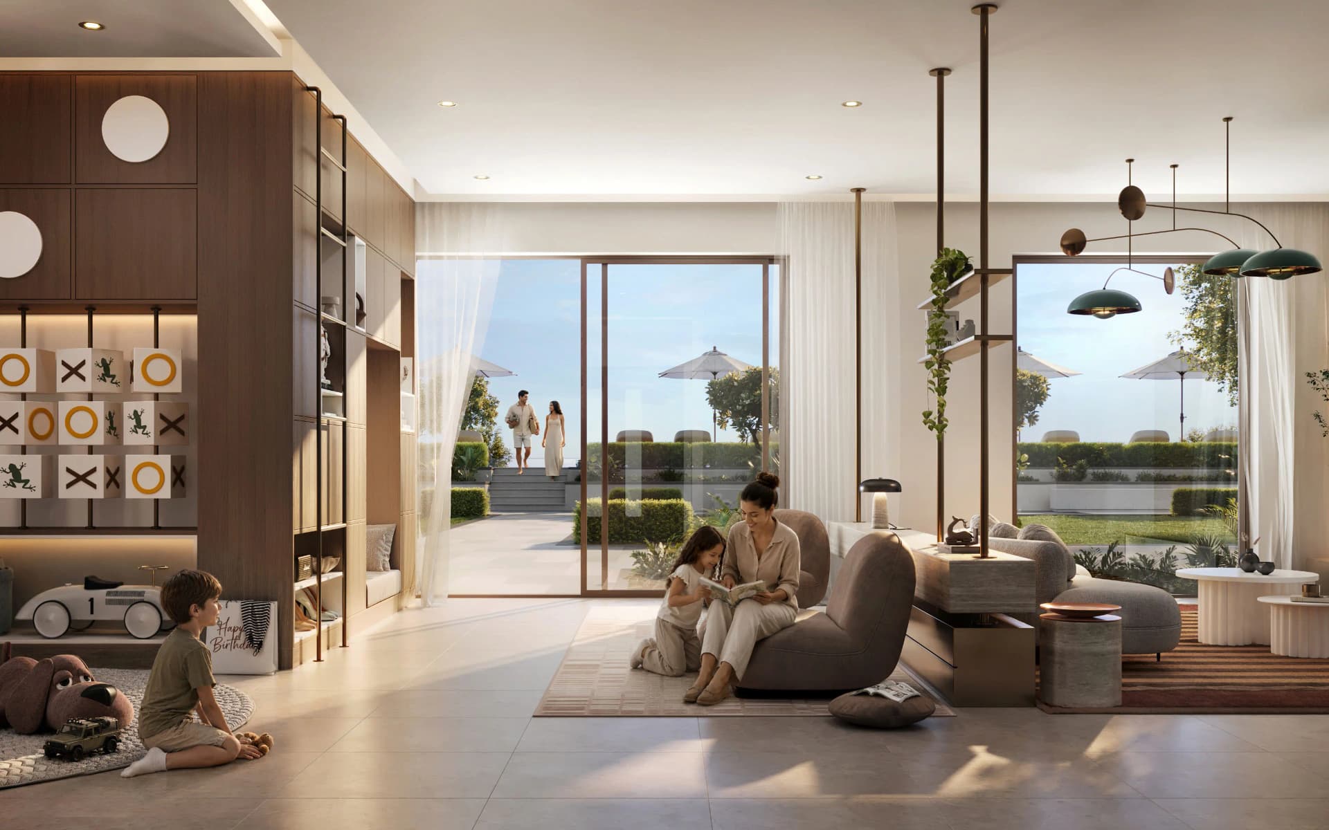 Family in open plan living room with garden views, Emaar South Dubai