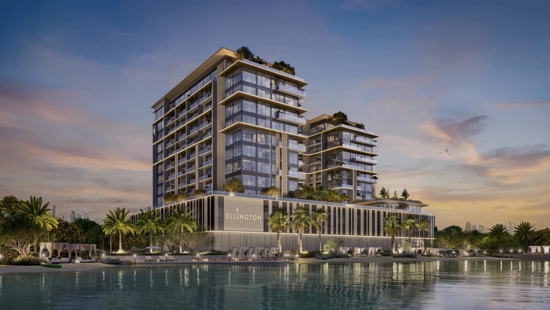 Lagoon-facing residences at dusk in Meydan Horizon, MBR City, Dubai, featuring illuminated balconies and waterfront views.